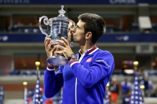 September 13, 2015 - Novak Djokovic poses with the trophy after defeating Roger Federer (not pictured) in the men's singles final match during the 2015 US Open at the USTA Billie Jean King National Tennis Center in Flushing, NY. (USTA/Ned Dishman)