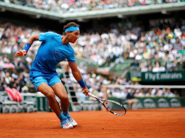 Rafael Nadal of Spain plays a shot to Quentin Halys of France during their men's singles match at the French Open tennis tournament at the Roland Garros stadium in Paris, France, May 26, 2015. REUTERS/Jean-Paul Pelissier